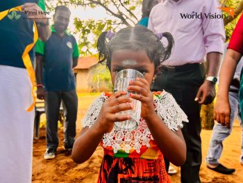 Poor Sri Lankan children drinking water