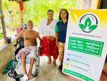 Vanni Hope initiative supporting disabled individuals in rural Sri Lanka, wheelchair donation improving mobility and dignity, sponsored by Mr. Sri Kulasegaram, elderly couple receiving essential health aid, uplifting families in Mutur Trincomalee, Vanni Hope volunteers delivering mobility support, restoring independence and hope, humanitarian project enhancing health and wellbeing, caring community action in Sri Lanka, empowering vulnerable families, compassionate aid fostering inclusion, promoting dignity and accessibility through kindness