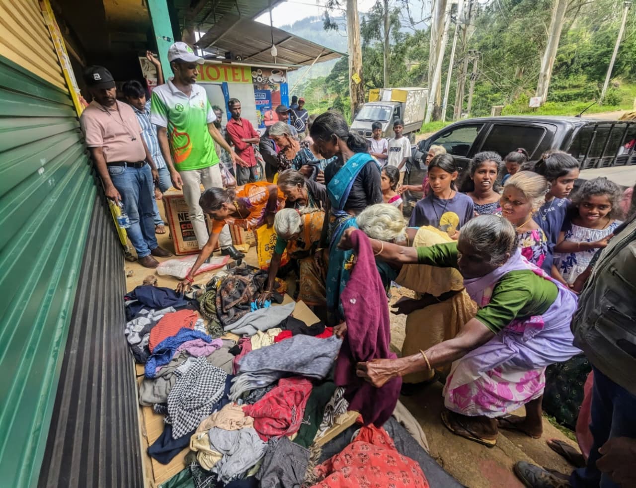 Emergency food, clothing and toy distribution by Vanni Hope to families in Loolecondera Estate after heavy rains and landslides