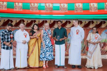 Valluvan Thillairajah receiving the Young Humanitarian of 2025 Award at the Sydney Pongal Festival on behalf of the NSW Tamil Community