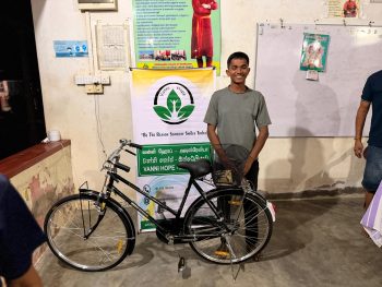 Vanni Hope providing a bicycle to an A-level student at a children’s home in Batticaloa, supporting education access and travel to school and tuition classes in Sri Lanka