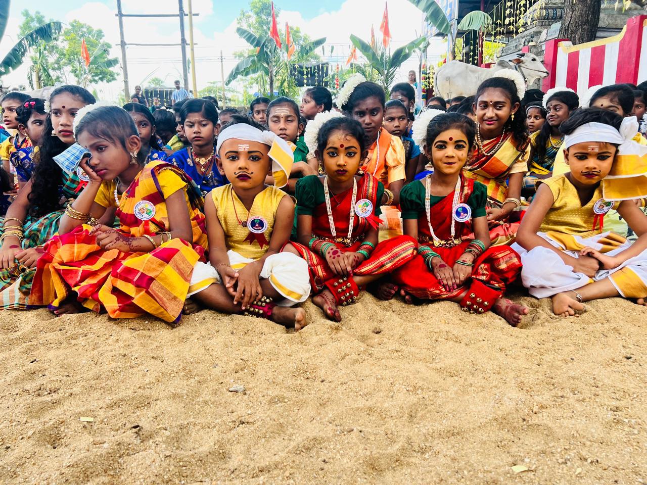 school cultural celebration in Sri Lanka, students participating in a traditional festival, community school event in Batticaloa, children taking part in cultural activities, symbolic gifts distributed to students, school-based cultural education programme, students and teachers gathered for a celebration, promoting gratitude and cultural values, educational community event