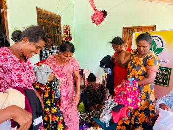 emergency clothes distribution Thanganagar Sri Lanka, flood relief support Trincomalee District, disaster affected families receiving clothing, humanitarian response rural Sri Lanka, community clothes distribution program, post flood emergency assistance Sri Lanka