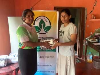 elderly man bedridden receiving hygiene support in Thenmarachchi, family caregiver assisting elderly patient at home in Sri Lanka, distribution of pumpers for medical hygiene support, humanitarian assistance for vulnerable elder in Kaithadi Nunavul, home based care support for bedridden patient