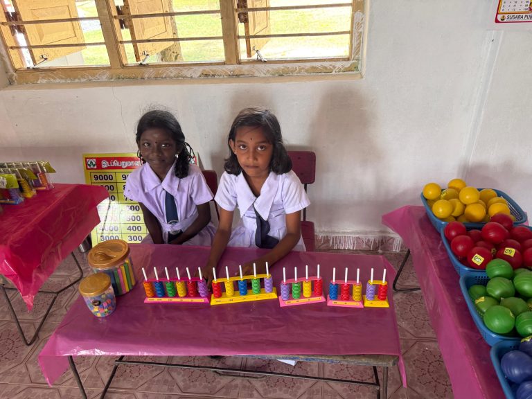 Vellawely Kalaimagal Maha Vidyalayam mathematics classroom opening, students attending classroom opening event Batticaloa, school children engaging with mathematics learning tools Sri Lanka, teachers and students gathered in classroom setting, mathematics equipment arranged in classroom Batticaloa, students participating in interactive learning activities Sri Lanka, rural school education support project Eastern Province, classroom environment with students and teachers Batticaloa