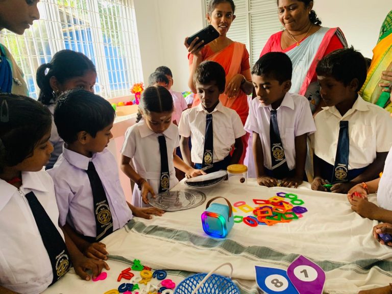 Kaithady Muthukumaraswamy Maha Vidyalayam mathematics classroom opening, students participating in mathematics classroom event Jaffna, school children using learning tools in classroom Sri Lanka, teachers and students gathered for classroom opening ceremony, mathematics learning equipment displayed in school classroom, students engaged in interactive learning activities Jaffna, rural school education support project Northern Province, classroom environment with students and teachers Sri Lanka