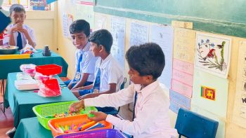Pookkaddy GTM School mathematics classroom opening Jaffna, students using mathematics learning tools in classroom Sri Lanka, school children engaged in lessons with new resources, teachers and students at classroom event Jaffna, mathematics equipment displayed in classroom Sri Lanka, rural school education support Northern Province, students participating in interactive learning activities, classroom environment with students and teachers Sri Lanka