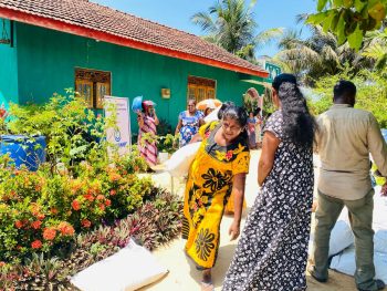 women receiving plant seedlings in Muttur, home gardening support distribution Sri Lanka, grow bags and compost distribution for women farmers, climate resilient agriculture initiative Trincomalee, women beneficiaries Puthumai Pengal Society
