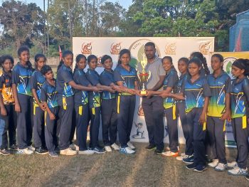 women’s cricket match Jaffna District Cricket Ground Mallakam, female cricket players competing in T20 tournament Sri Lanka, women’s cricket teams in action Jaffna, trophy presentation at women’s cricket event Sri Lanka, players receiving awards and medals cricket tournament, community gathered at women’s sports event Jaffna, cricket match scoring and umpiring setup Sri Lanka, women athletes competing in organized cricket tournament