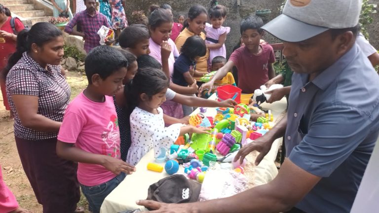 Vanni Hope clothing distribution, sports equipment donation Sri Lanka, families receiving aid in Kandy District, children with sports equipment, humanitarian support in Mudalwatta Village, community charity event Sri Lanka, Vanni Hope community outreach, Australian donor supported initiative